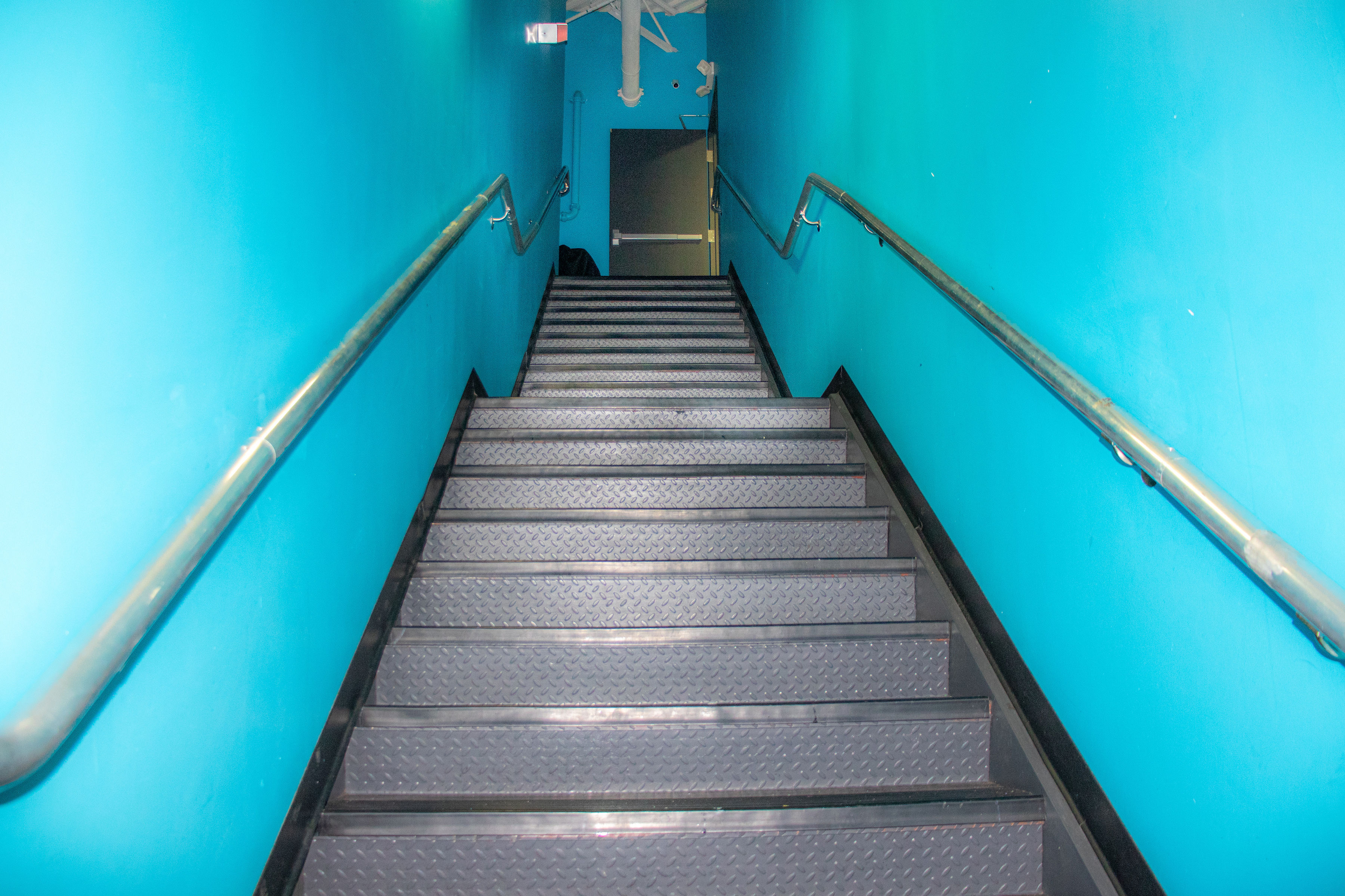 Staircase leading to mezzanine level in Unit C01