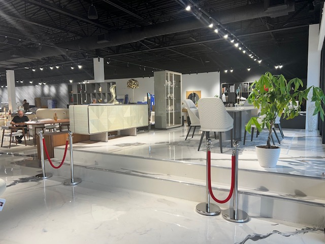 Furniture showroom floor with red rope stanchions
