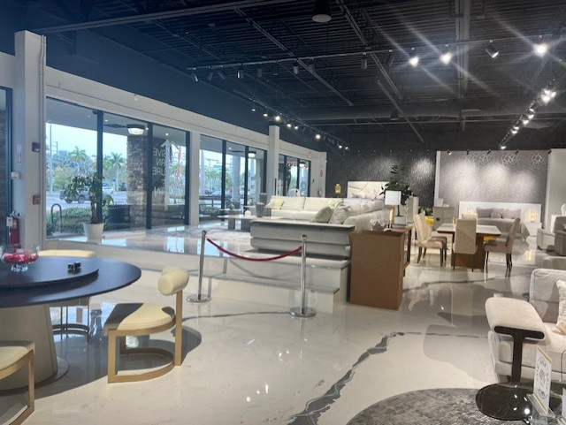 Furniture showroom interior with floor-to-ceiling glass storefront
