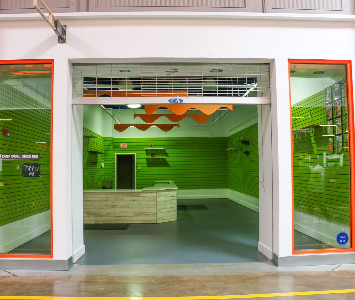 Unit G16 storefront with roll-up gate